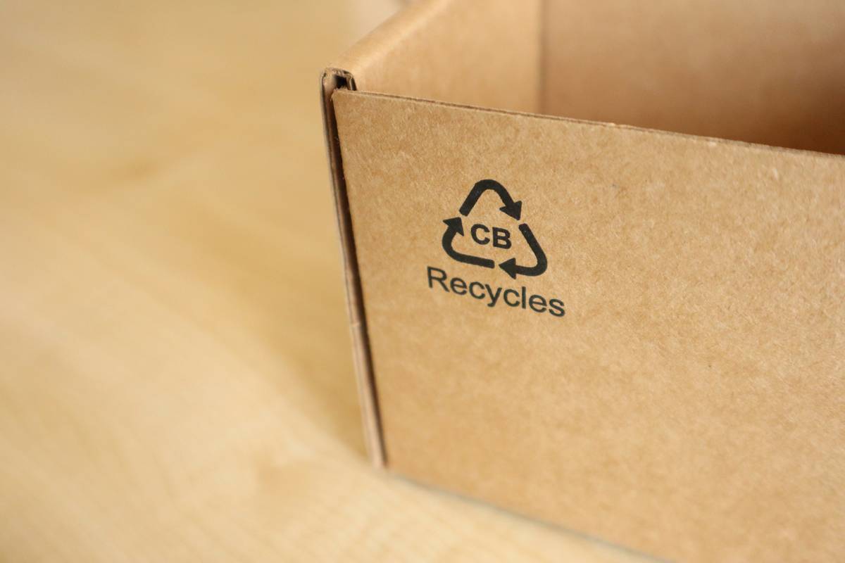 Roll of biodegradable toilet paper next to compost bin with text: eco friendly product why is it matters for septic safety